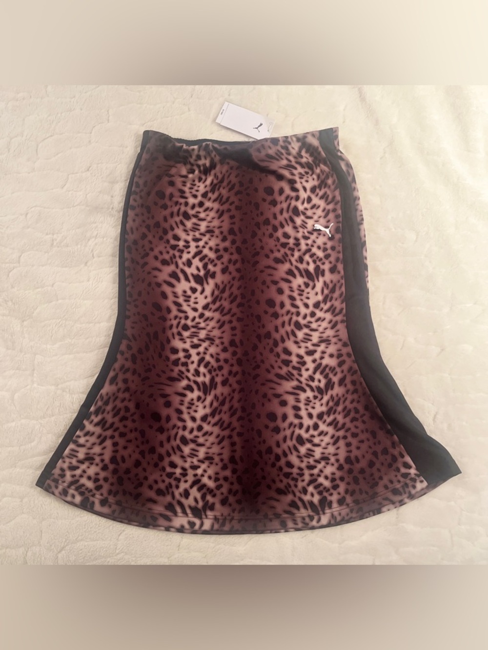 PUMA Women's T7 Leo Luxe midi skirt in black with an all-over leopard print.S